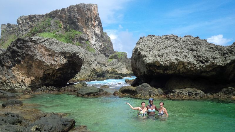 Clear turquoise water in a rocky natural pool on the Saipan coast